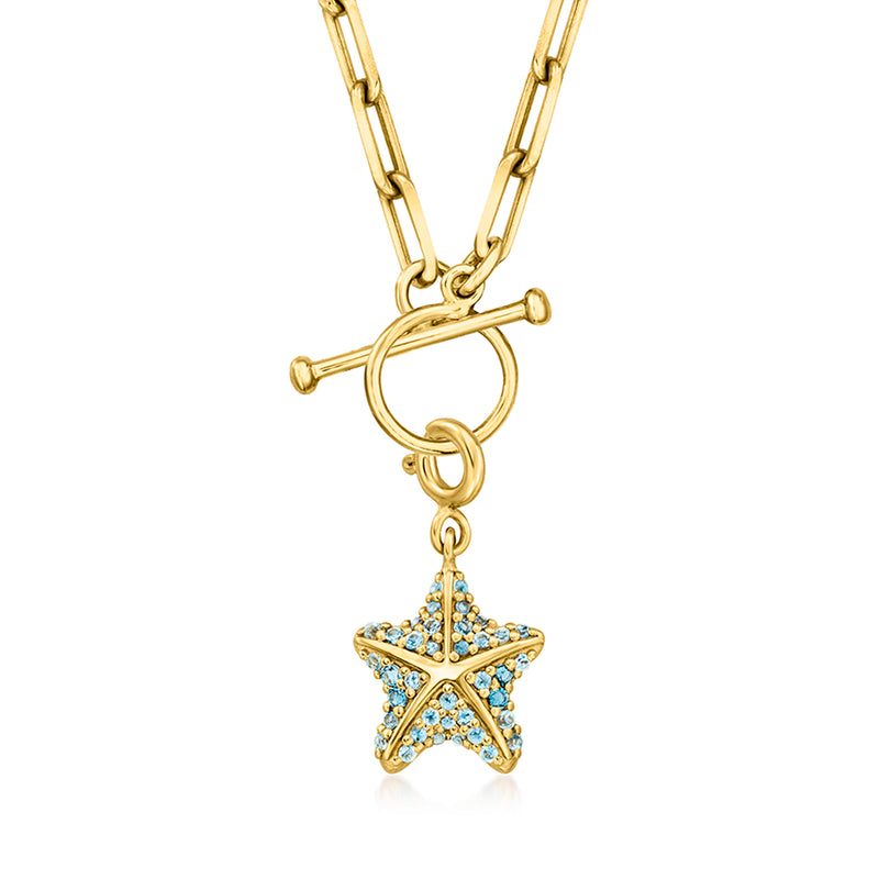 Starfish charm with blue topaz in gold over sterling