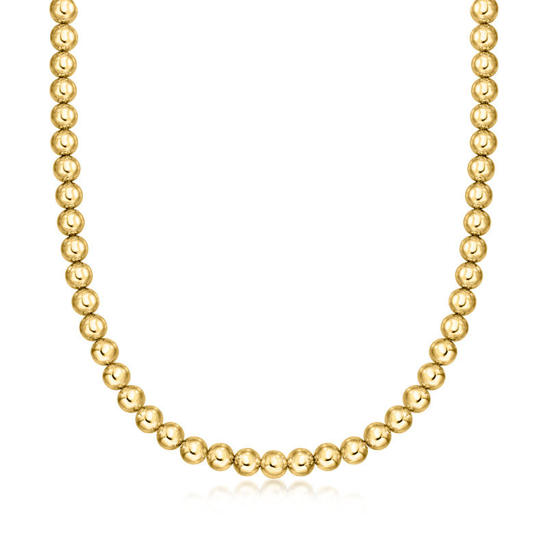 Gold bead necklace with evenly spaced small round beads.