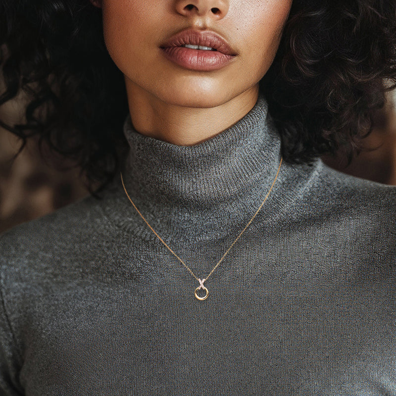 Diamond XO pendant necklace in 14kt yellow gold, shown at neckline on a model