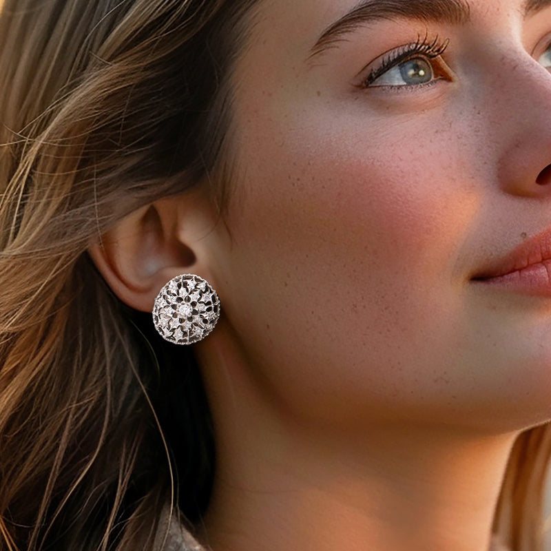 Round openwork diamond earrings, stud style with shimmering floral lace pattern