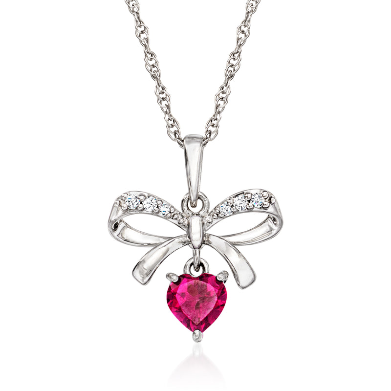 Sterling silver heart pendant with bow, pink rhodolite garnet center and clear stones