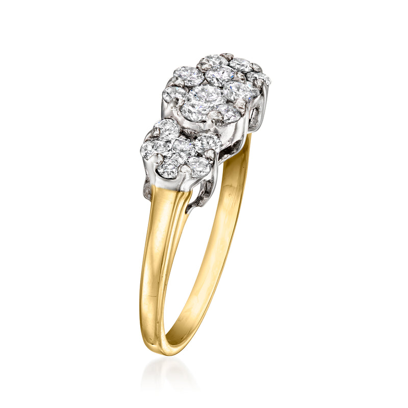 Yellow gold diamond cluster ring with oval and round stones in raised bezel