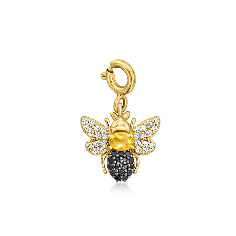 Gold bee charm with citrine center, white topaz wings, and black stone body