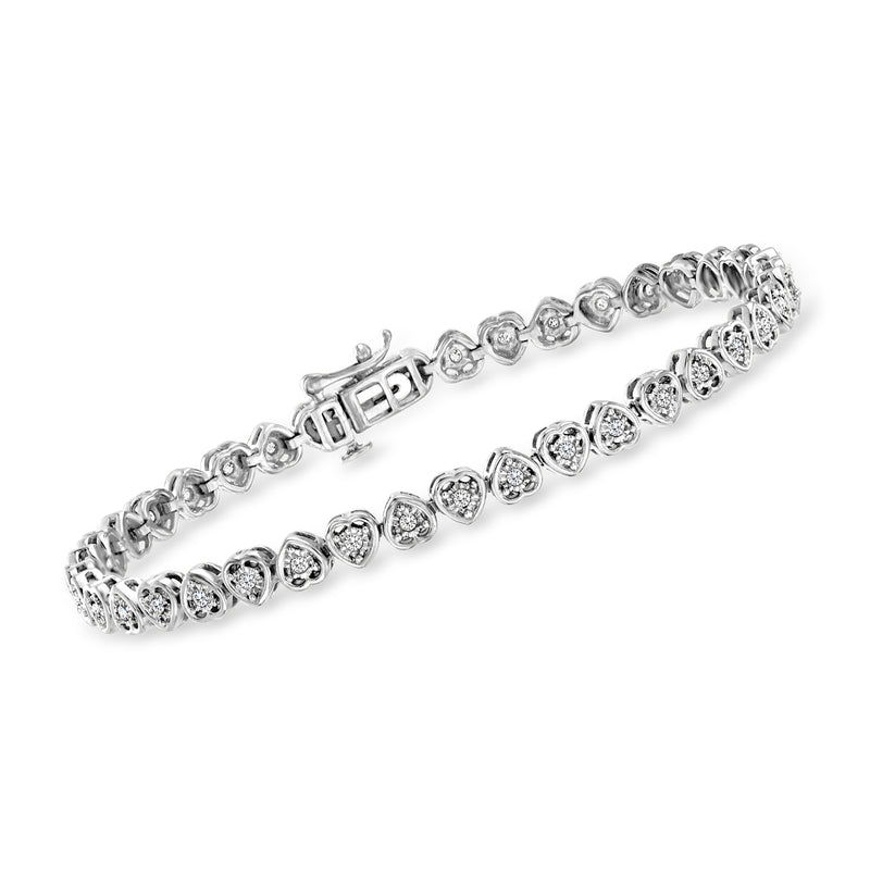 Sterling silver tennis bracelet with round diamonds in heart settings