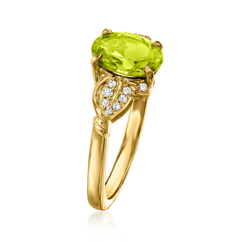 Gold ring with large oval peridot-green stone and white zircon halo on side