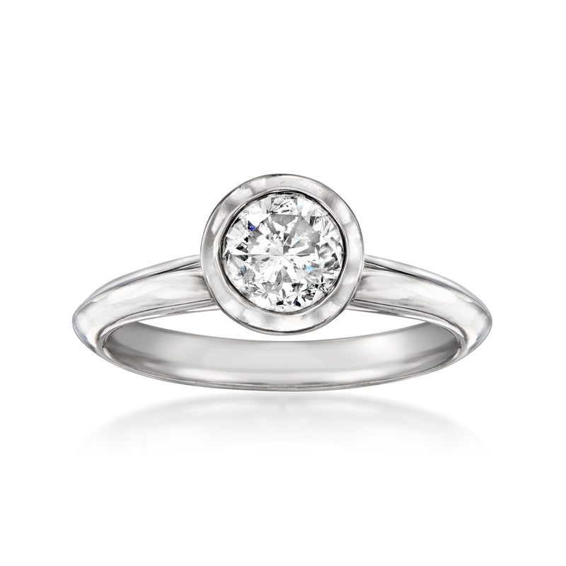 Bezel-set diamond solitaire ring in 14kt white gold with round center stone