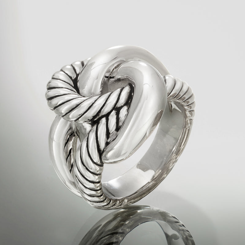 Polished sterling silver roped knot ring, close-up of twisted knot shank