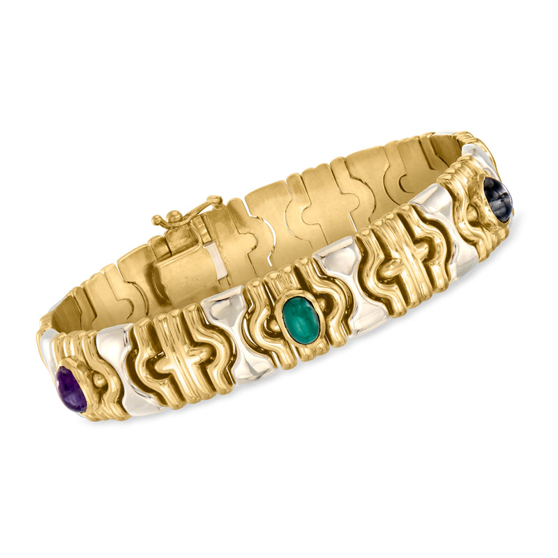 Two-tone gold multi-gemstone bracelet with green and purple stones; sculpted link design