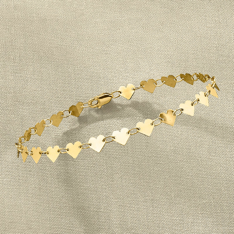 10kt yellow gold heart-link bracelet with small heart charms and clasp