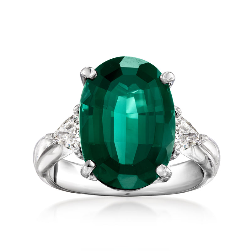 Vintage platinum ring with large oval green tourmaline and four diamond side accents
