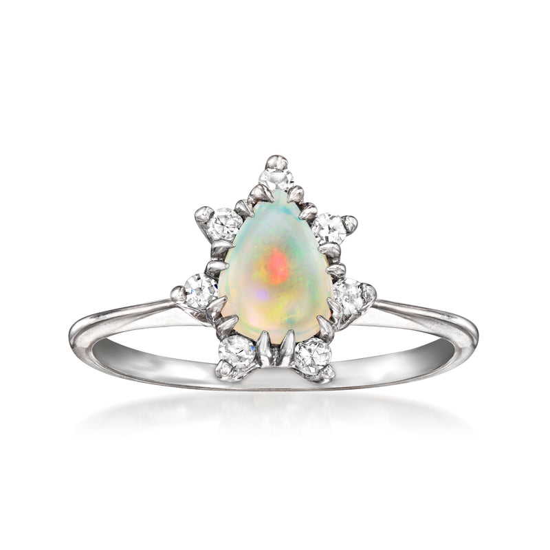 Vintage opal and diamond ring in 14kt white gold, oval opal center with halo