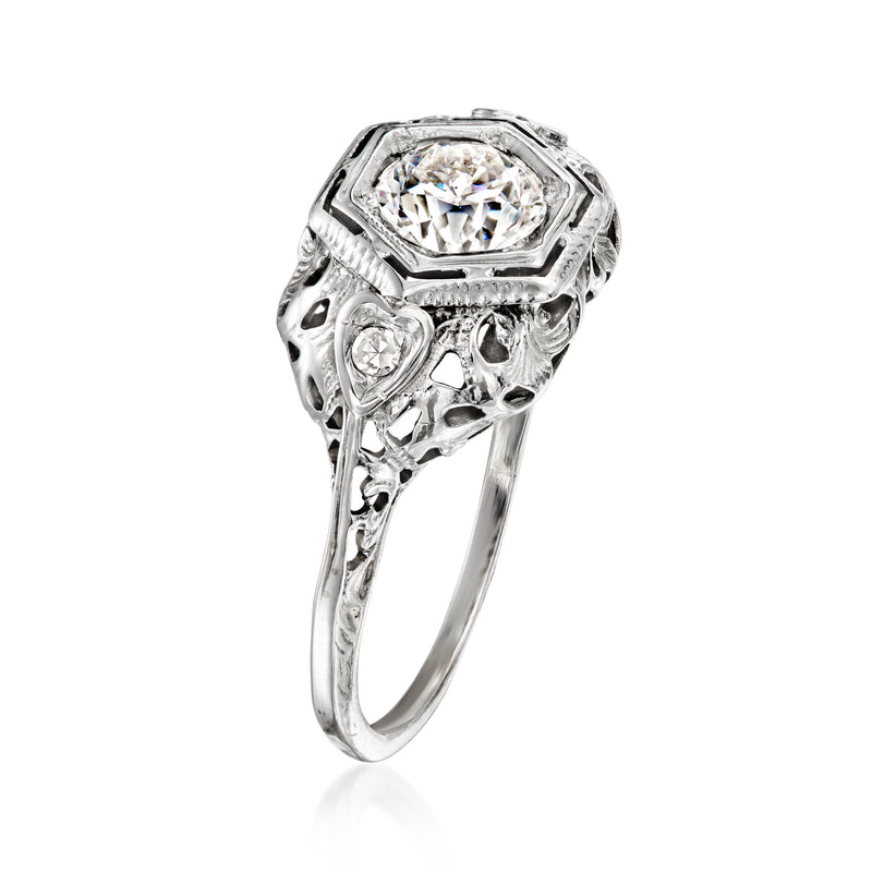 18kt white gold vintage diamond ring with round center stone and openwork filigree