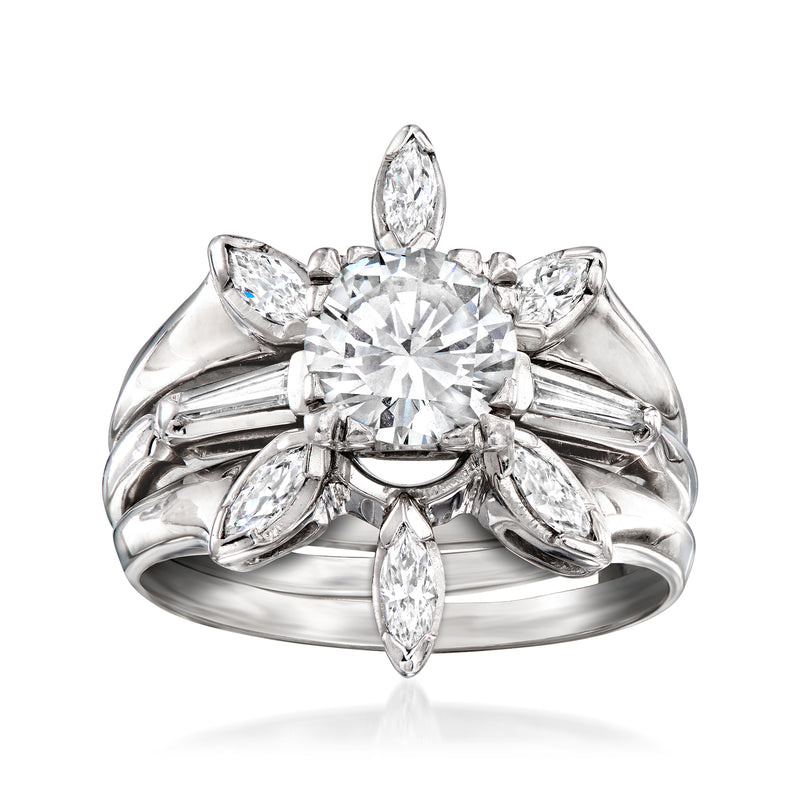 Diamond ring with round center stone, pear and marquise accents on white metal band