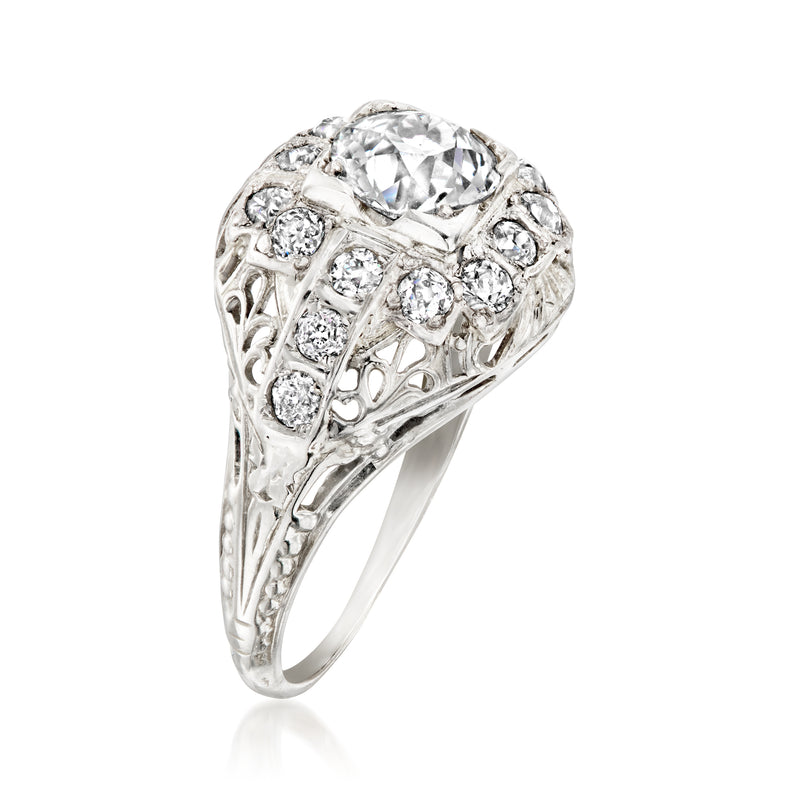 White gold vintage diamond filigree ring with large oval center and small round stones