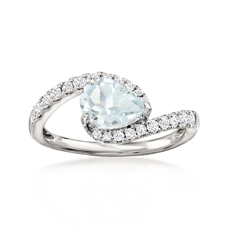 Aquamarine and diamond ring in 14kt white gold, oval center halo and side stones