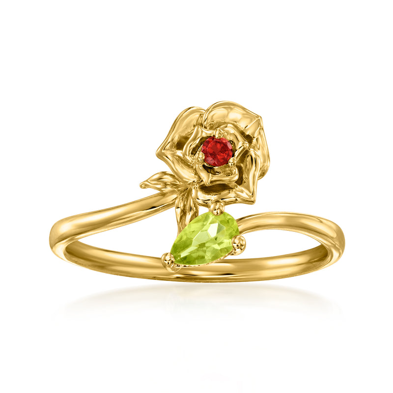 Gold-tone bypass ring with peridot green center and red flower accent