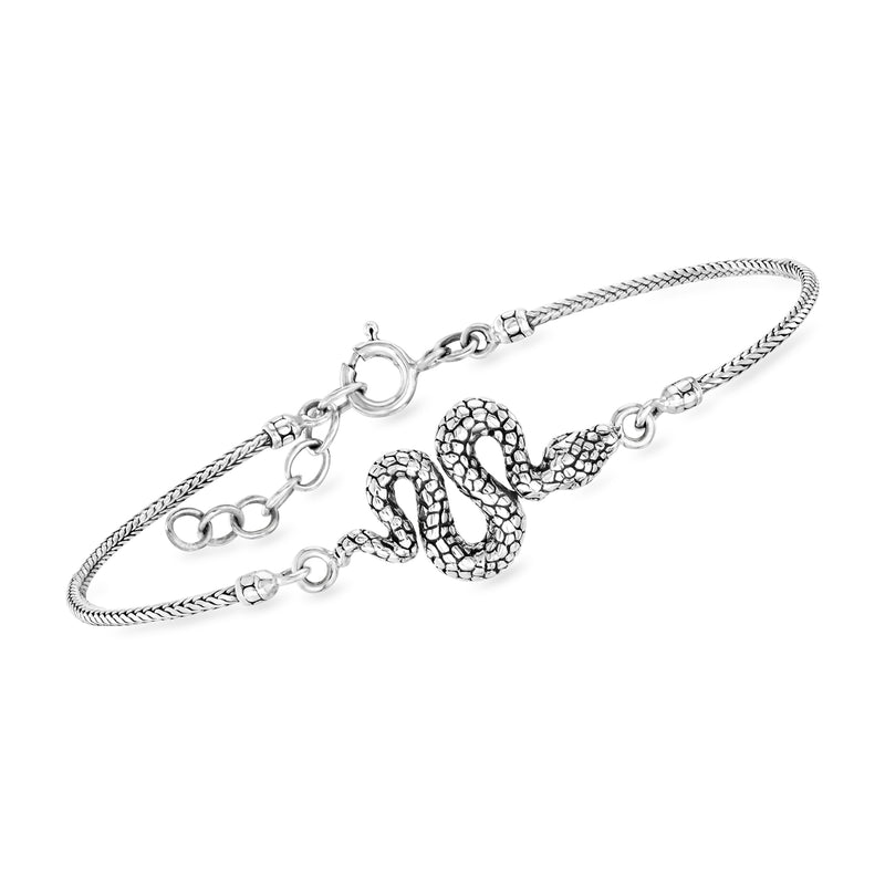 Sterling silver snake bracelet with coiled head charm, textured scales, and lobster clasp