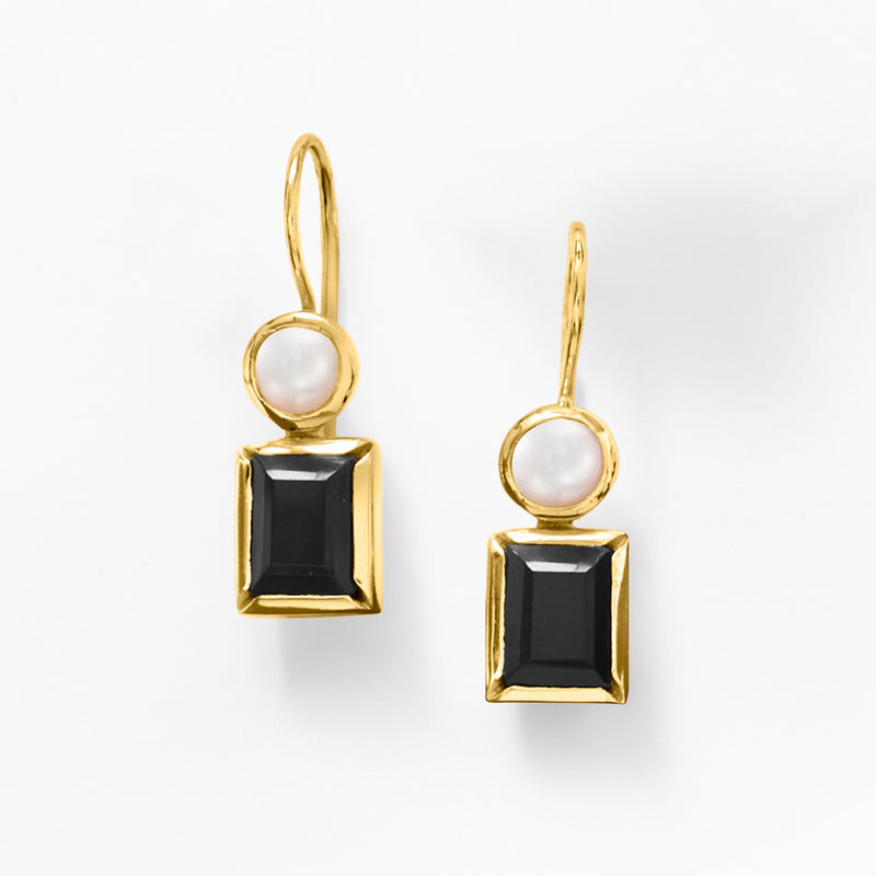 Gold drop earrings featuring white pearls over black square onyx accents