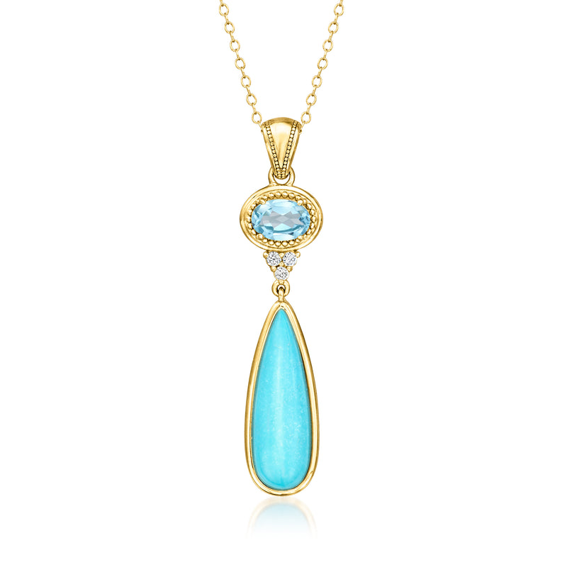Gold-tone pendant necklace with oval and teardrop blue stones and small clear accents