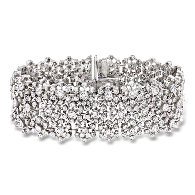 Wide diamond cluster bracelet in white gold with central baguette-style stone