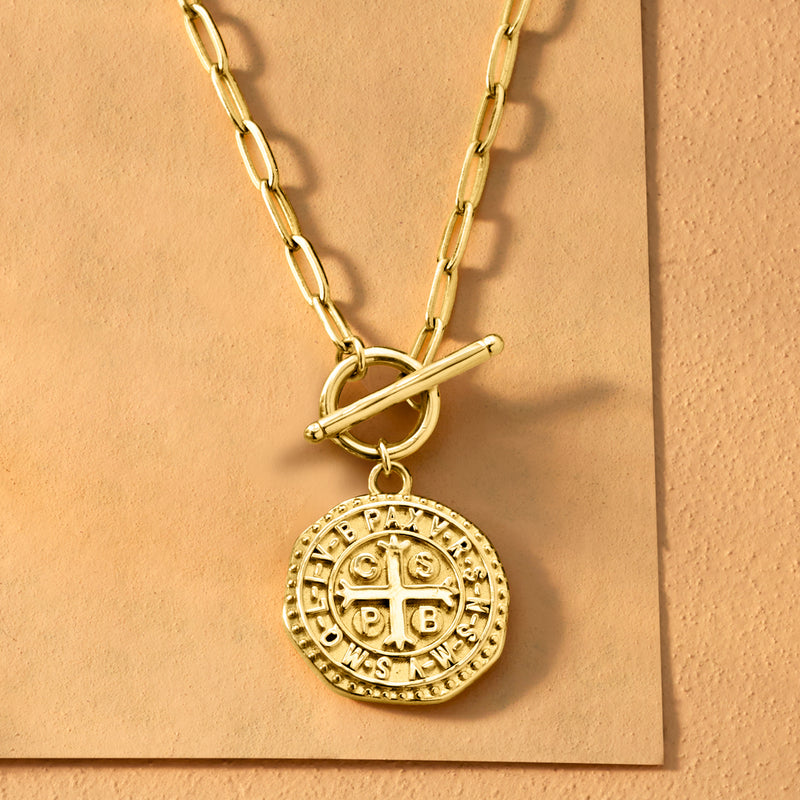 Gold coin pendant necklace with chunky chain and circular medallion drop charm