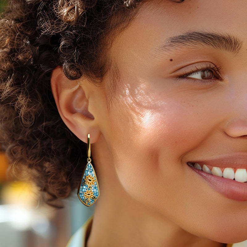 Gold hook drop earrings with blue teardrop enamel mosaic sunflower, on ear