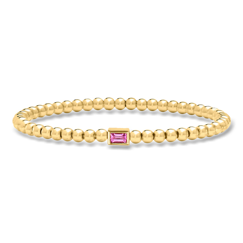 Gold bead stretch bracelet with pink square sapphire centerpiece, 4mm.