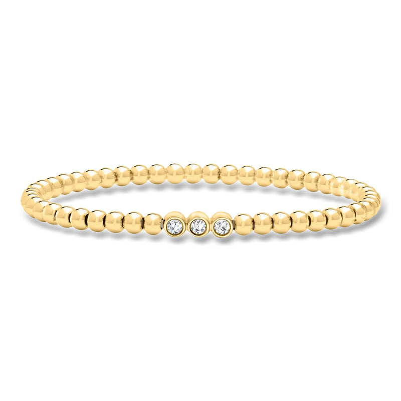 Gold bead stretch bracelet with four round lab-grown diamonds in a center row