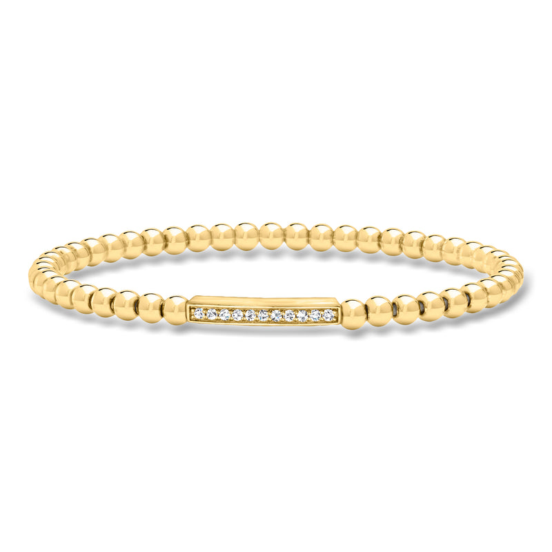 Gold bead stretch bracelet with diamond bar and small clear stones