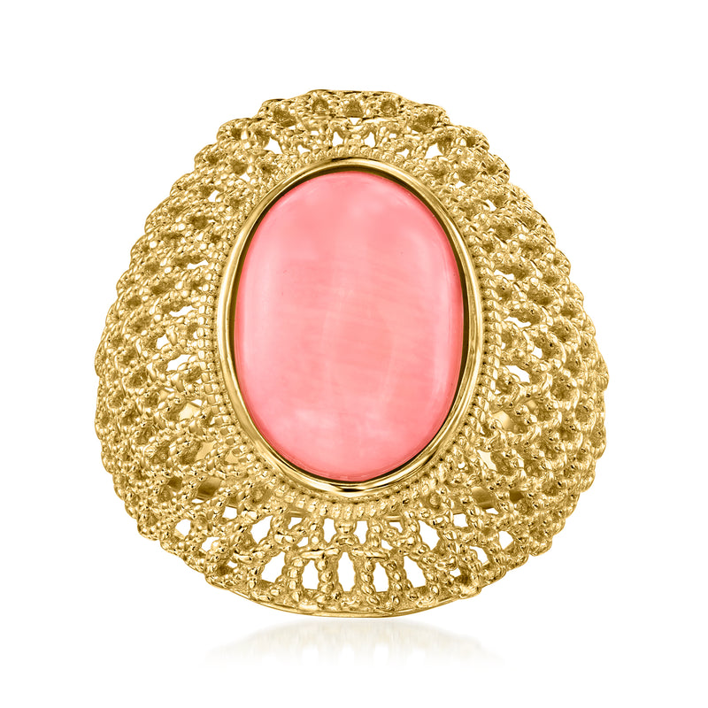 Oval pink coral dome ring with gold frame and textured scalloped filigree band