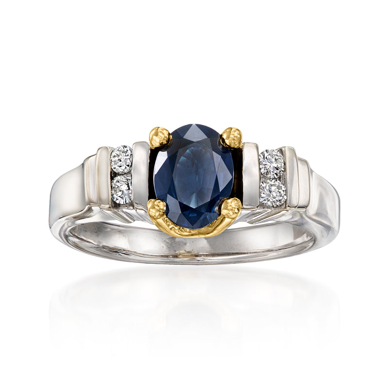 14kt white gold ring with dark blue oval sapphire and diamond side stones, gold accents