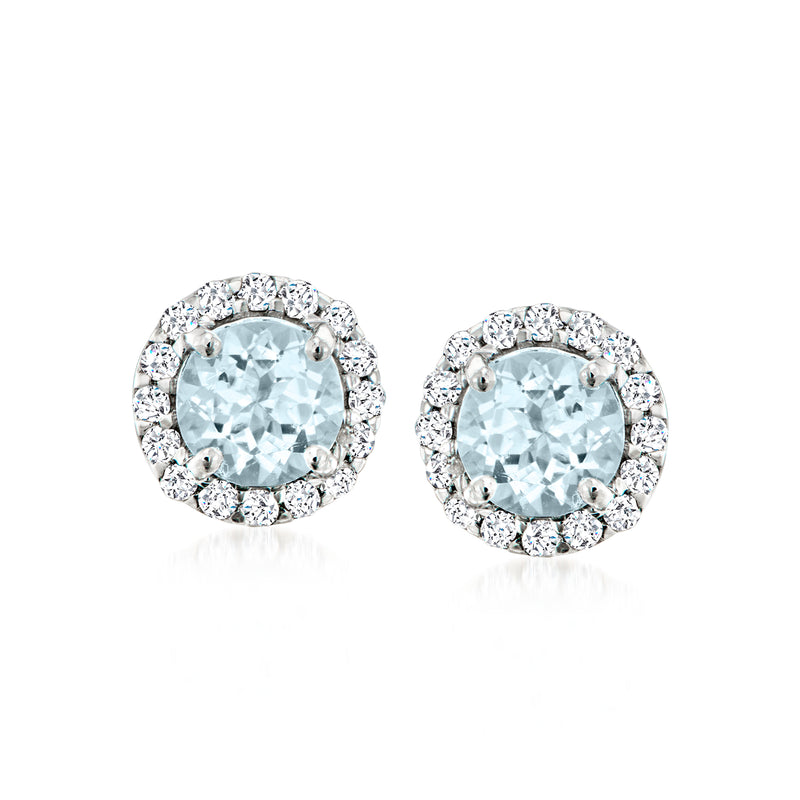 Platinum post earrings with round aquamarine center and diamond halo