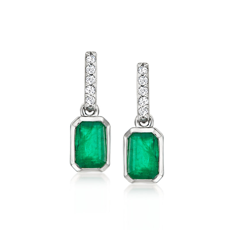 Platinum drop earrings with emerald-green emerald-cut stones and small diamond accents