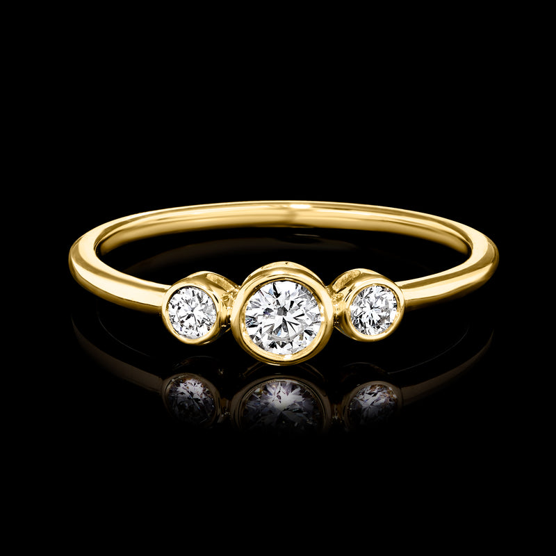 Yellow gold bezel-set three-diamond ring with round center stone and two side stones