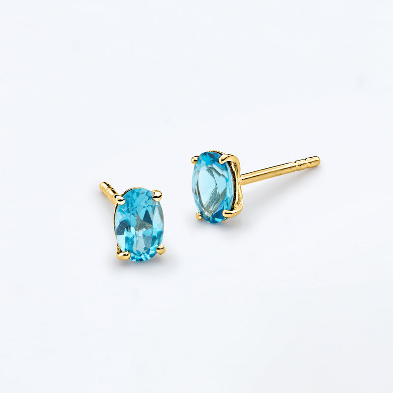 Oval London blue topaz stud earrings with gold posts, 14kt yellow gold