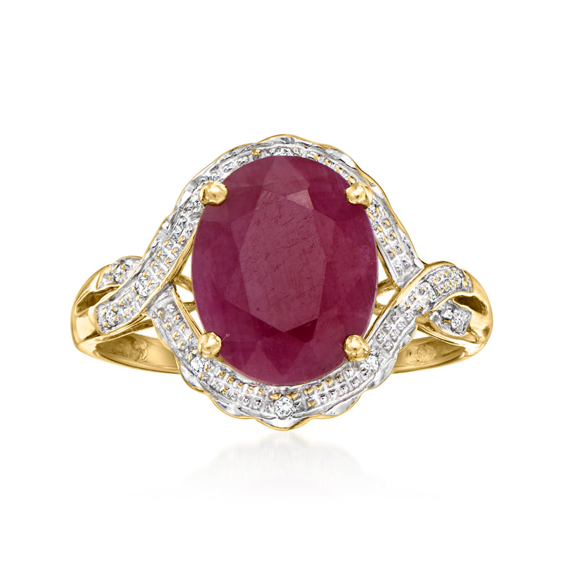 Vintage ruby and diamond ring with oval center stone in 10kt yellow gold, halo.