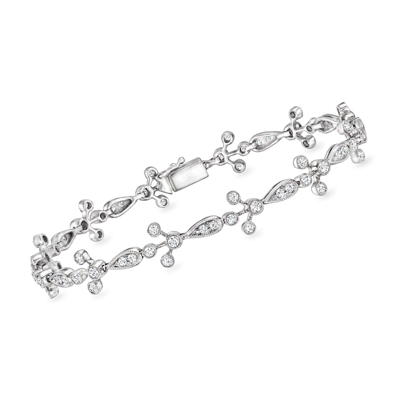 Vintage diamond link bracelet in 18kt white gold with oval and round stone clusters