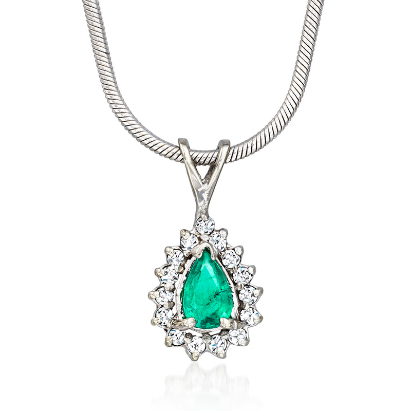 14kt white gold pendant necklace with pear emerald and diamond halo on a chain