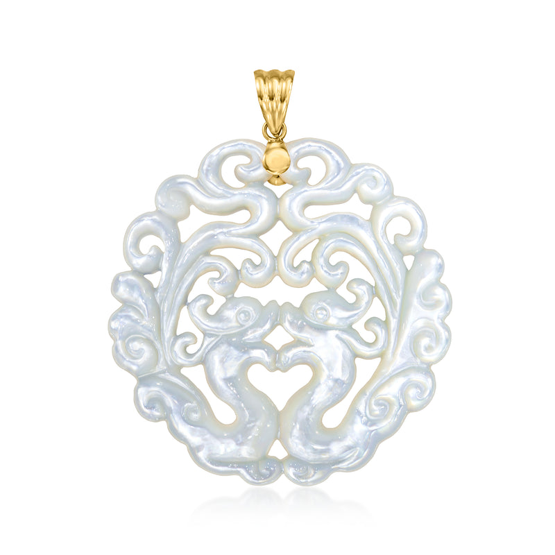 Carved mother-of-pearl phoenix pendant in round setting with yellow gold bail