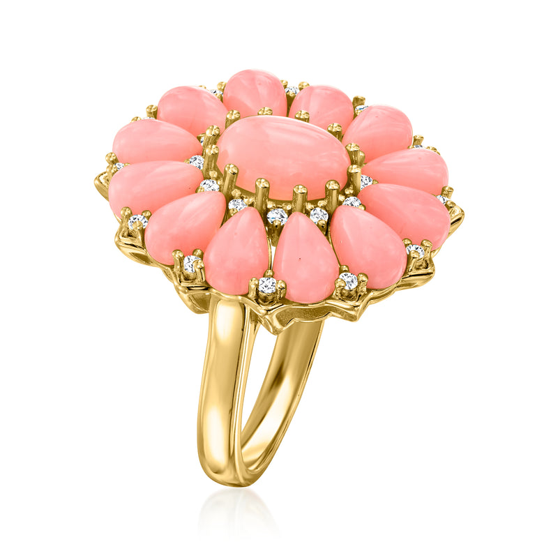 Gold floral ring with pink coral oval petals, clear zircon border, openwork band