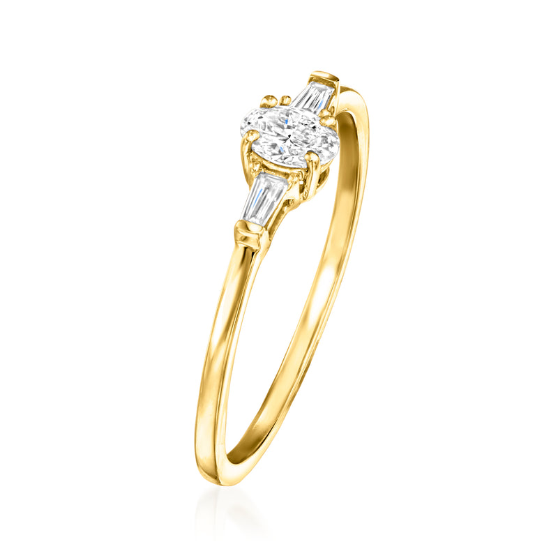 14kt yellow gold diamond ring with round center stone and baguette side stones, angled