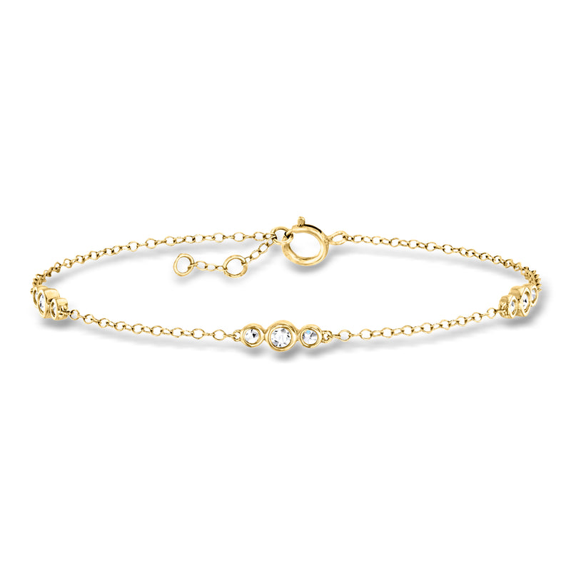 14kt yellow gold bracelet with three round bezel-set lab-grown diamonds, station trio.