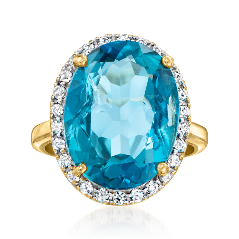 Vintage London blue topaz ring in 10kt yellow gold with white zircon halo and side stones