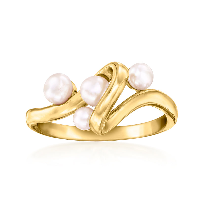 Gold swirl ring with three white cultured pearls on a curved band