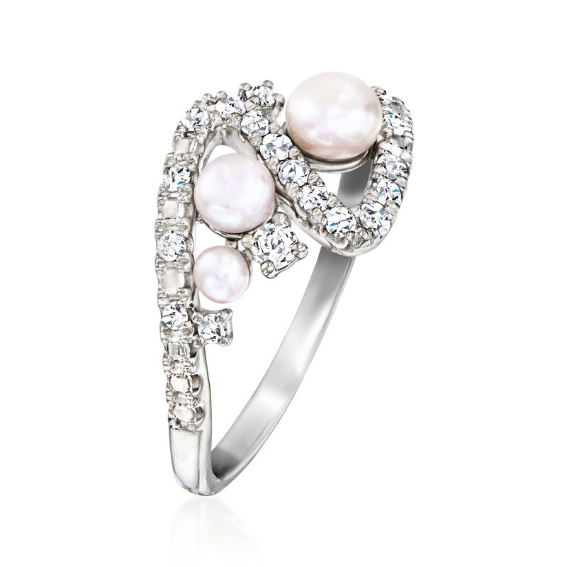 Sterling silver swirl ring with large white pearl center and diamond-look side stones
