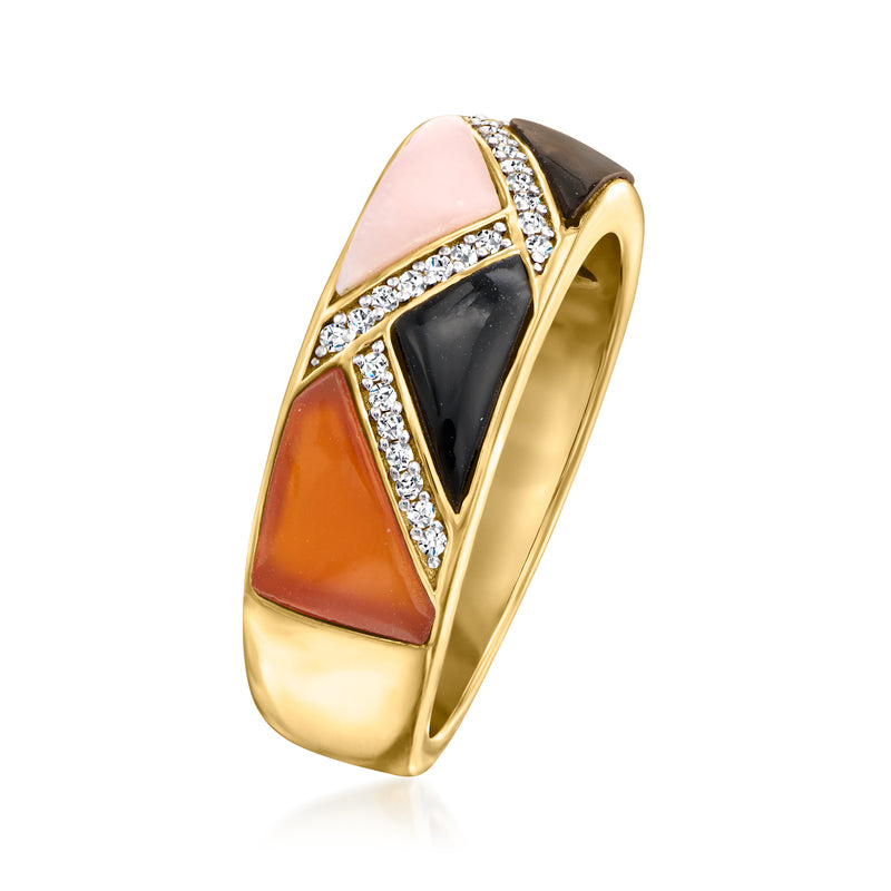 Gold-tone side view geometric ring with pink and orange inlays, black panel, crystal trim