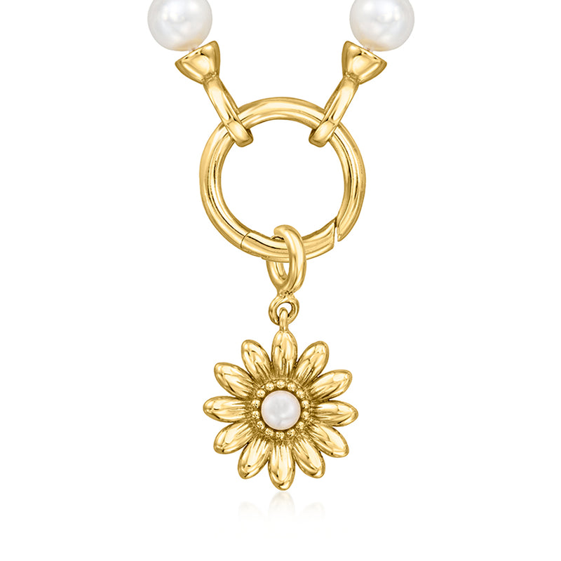 Gold hoop charm with two white pearls above and sunflower charm with cultured pearl center