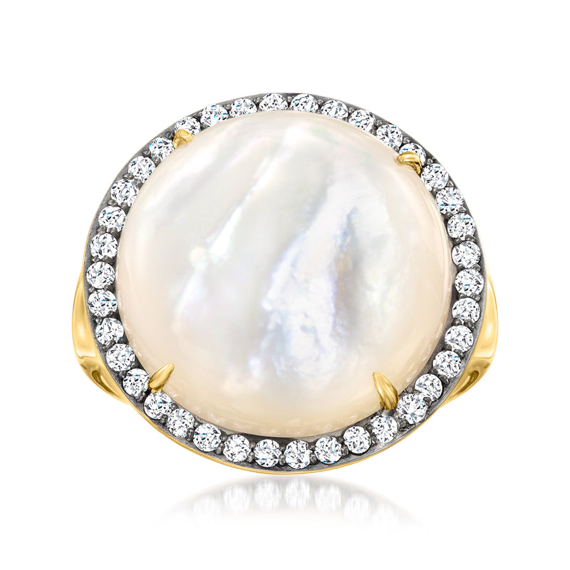 Gold-tone ring with oval mother-of-pearl center and round diamond halo