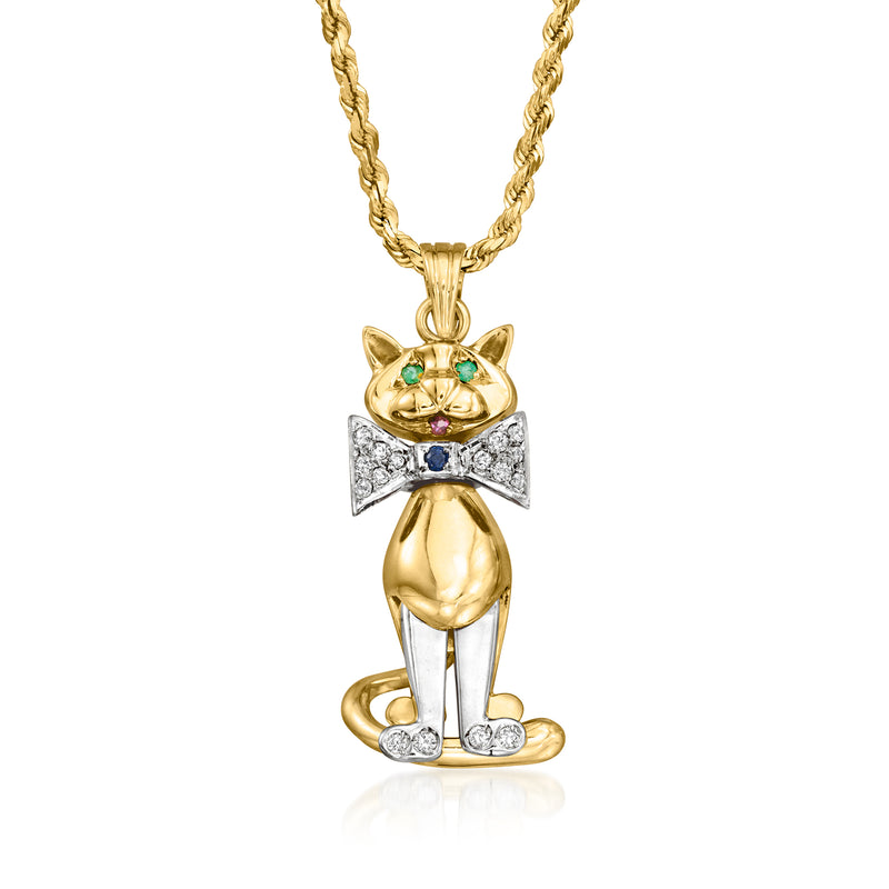 Two-tone gold cat pendant necklace with bow tie, diamonds and green gemstone eyes