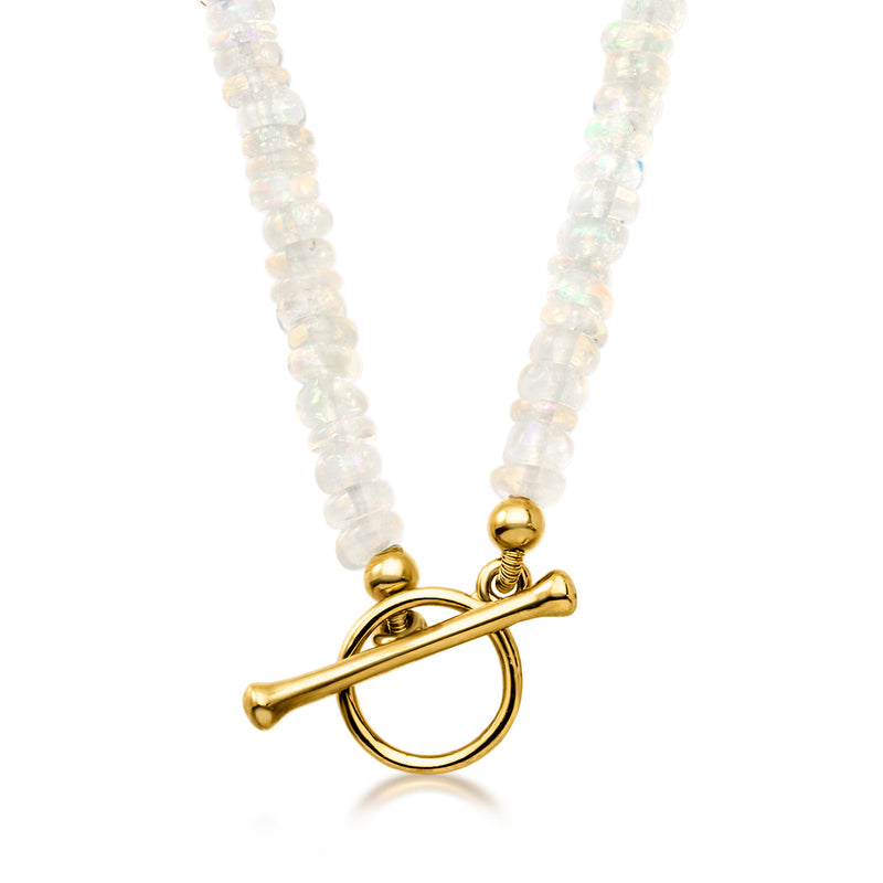 Opal bead toggle necklace close-up of gold toggle clasp with dangling bead